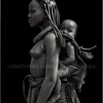 Himba Girl with Baby, Swaartbooisdrift, Namibia, 2010.
